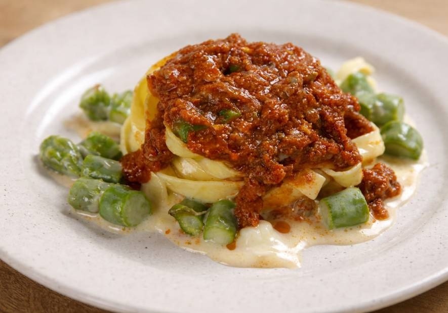 Tagliatelle Timballo with Ragù, Asparagus and Béchamel